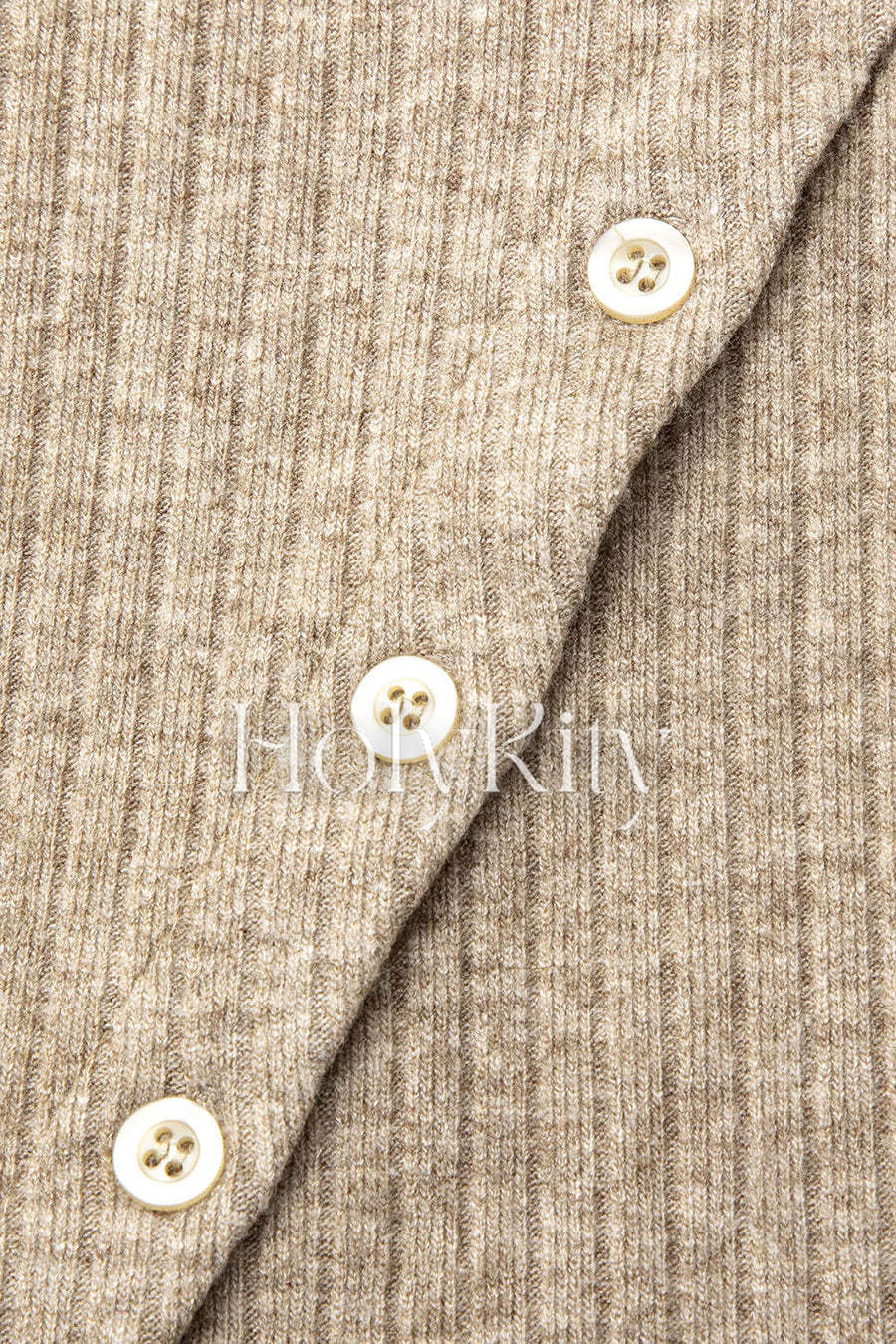 Mini-jupe asymétrique boutonnée en tricot côtelé