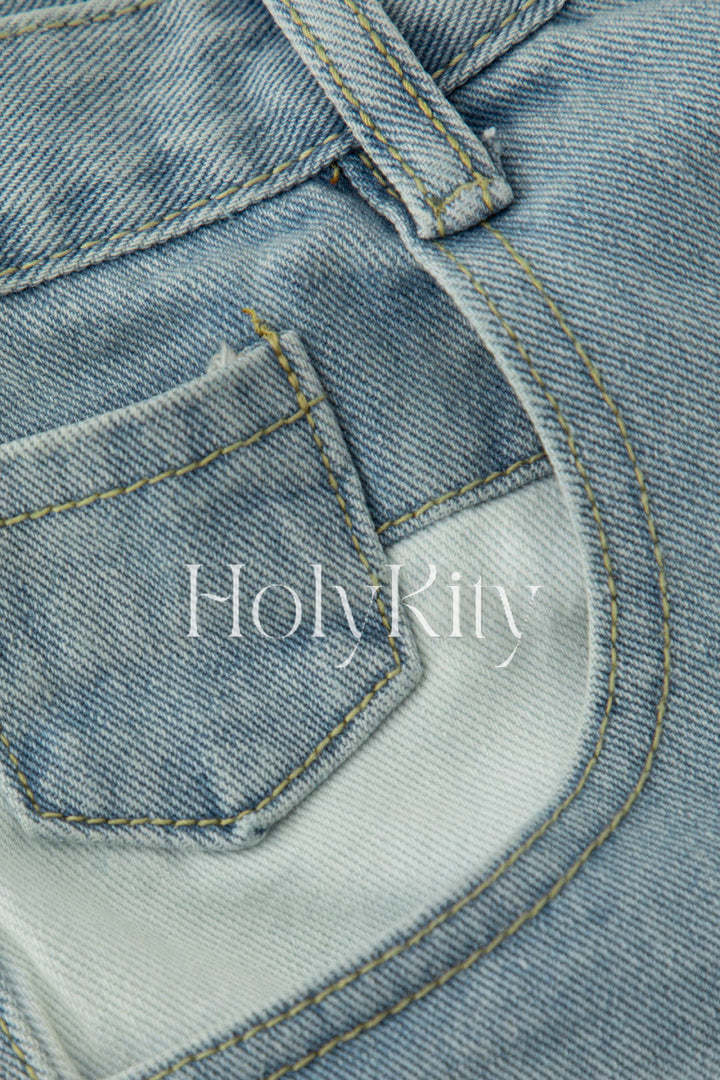 Short en jean asymétrique effiloché