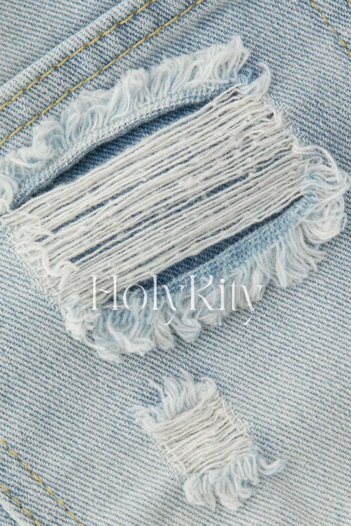 Short en jean usé effiloché orné de perles