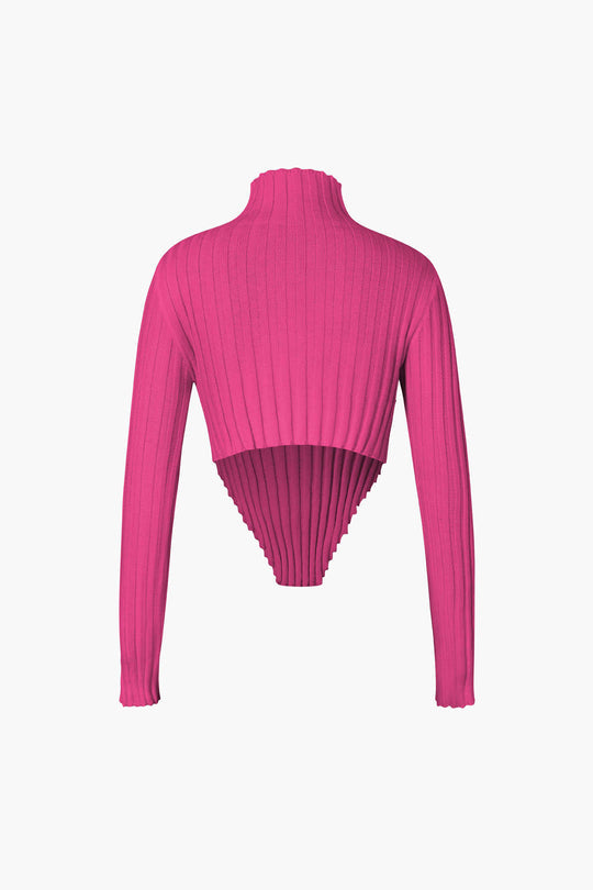 Haut asymétrique en tricot à col montant et bordure en laitue