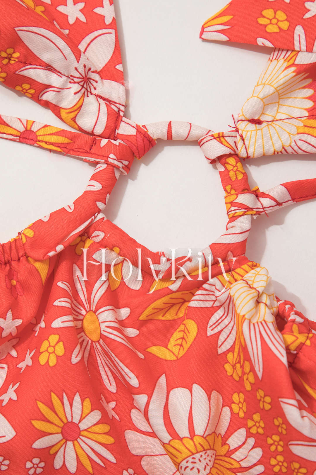 Robe longue fendue à découpes et col licou fleuri 