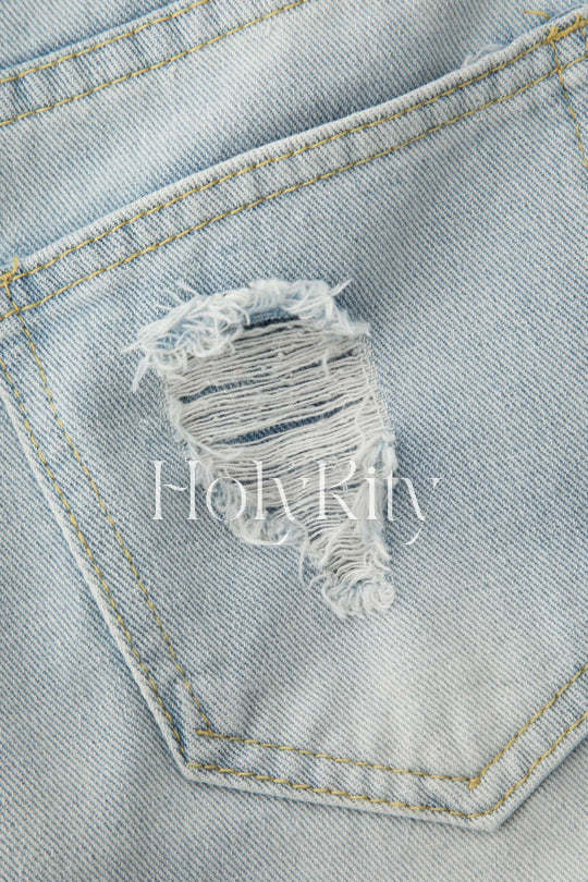 Short en jean usé effiloché orné de perles