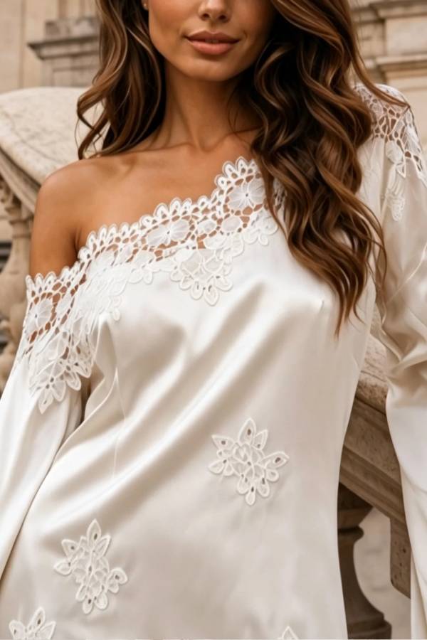 White satin mini dress with one-shoulder lace paneling