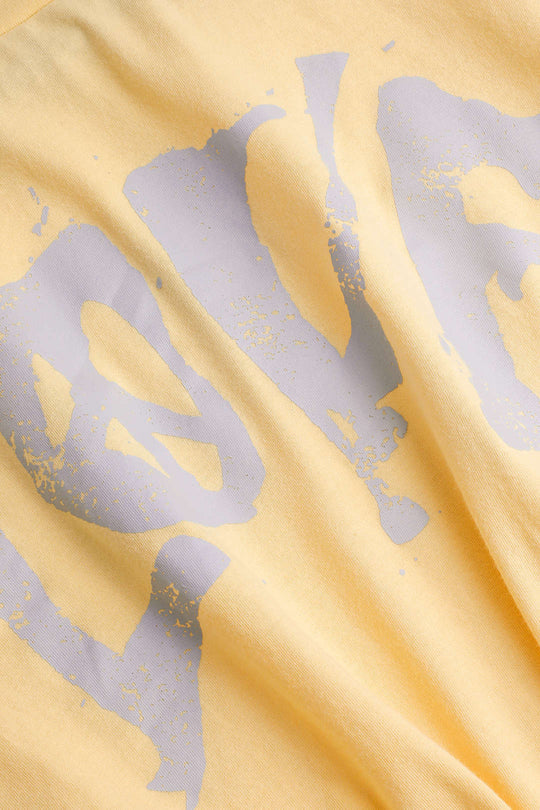 T-shirt à manches retroussées et ourlet noué Love 