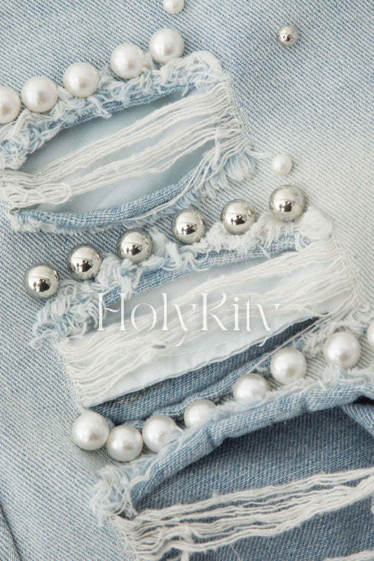 Short en jean usé effiloché orné de perles