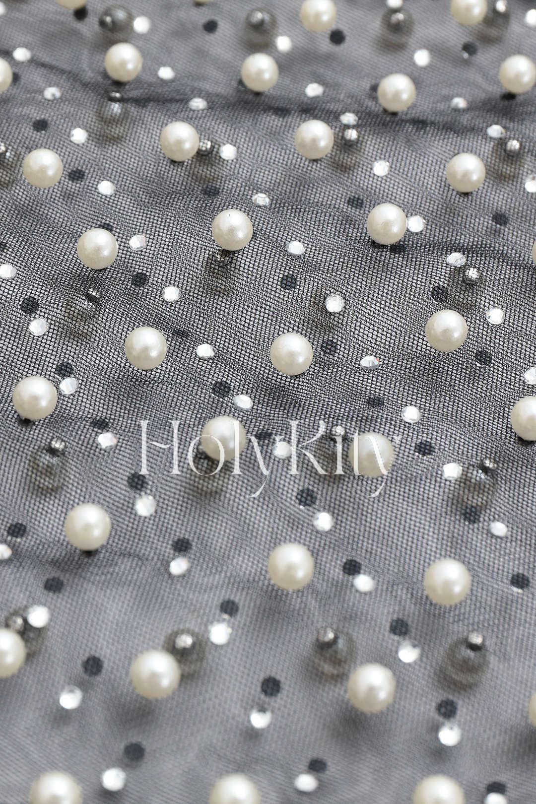 Haut en maille transparente orné de perles 
