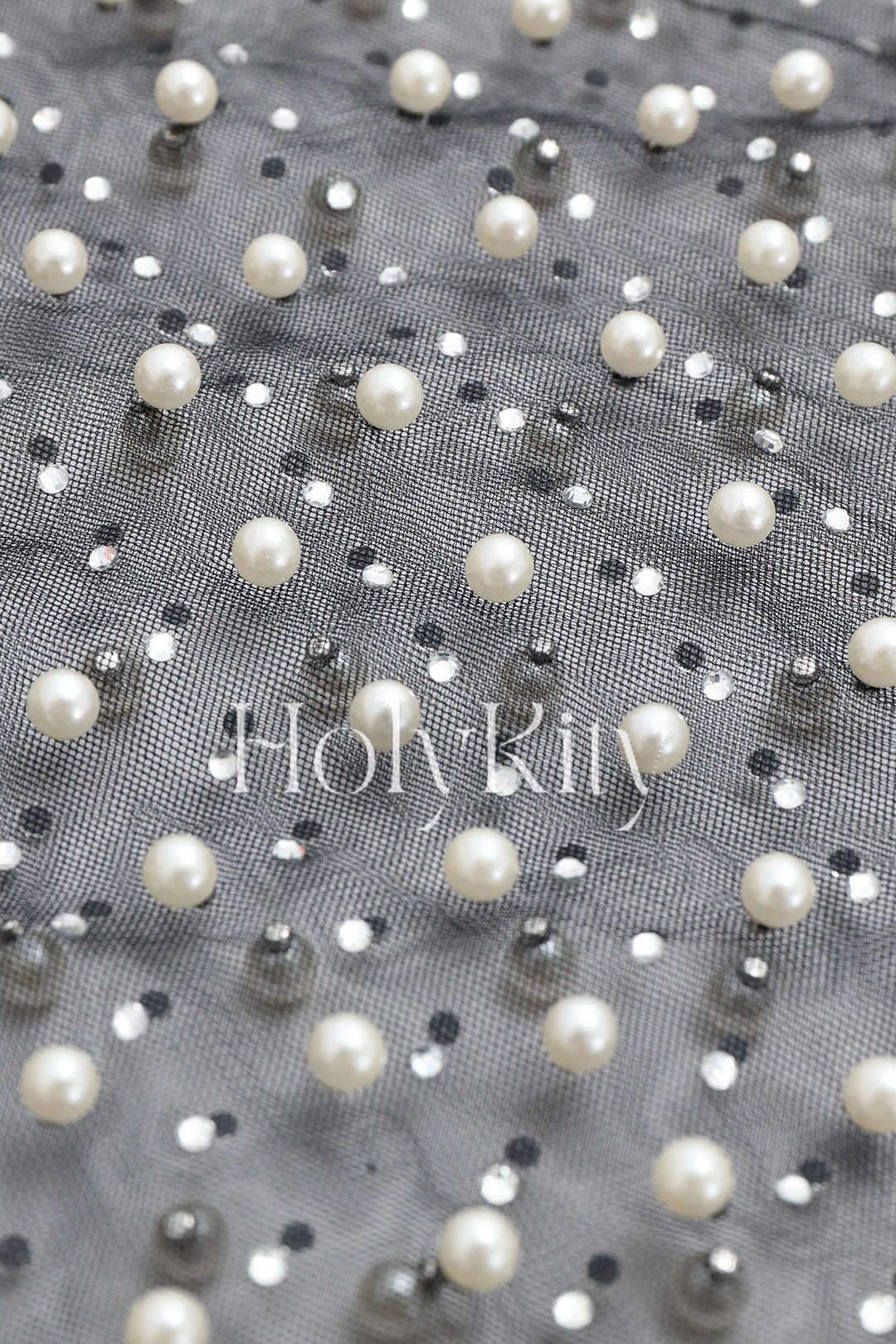 Haut en maille transparente orné de perles 