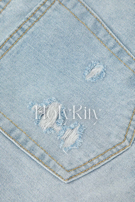 Short en jean effiloché et déchiré 