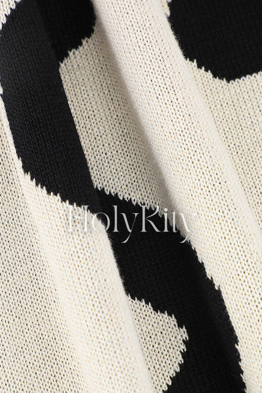 Robe en tricot à manches longues et découpes latérales à motif ondulé